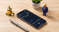 Trump rings Wall Street's opening bells as he ties his presidency to stock market gains